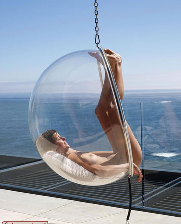 Nude Girl Relaxing In The Bubble Chair