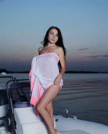 Niemira poses on board a luxury speedboat