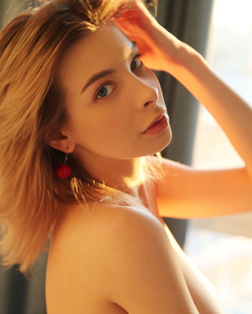 The Sexy Blonde Looks Studious In Her Glasses