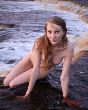 Cute Masha posing naked by the river