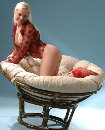 Cute blonde spreads her legs