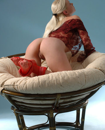 Cute blonde spreads her legs