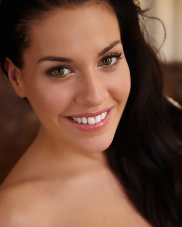 gorgeous long haired brunette smiles