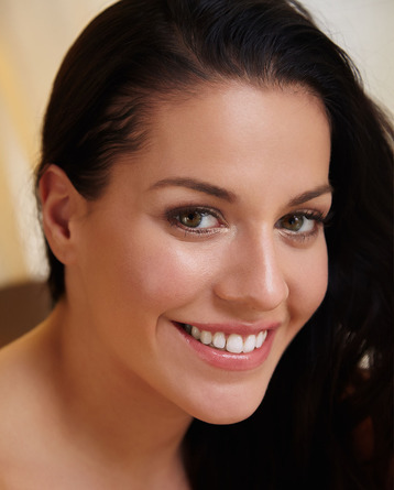 gorgeous long haired brunette smiles